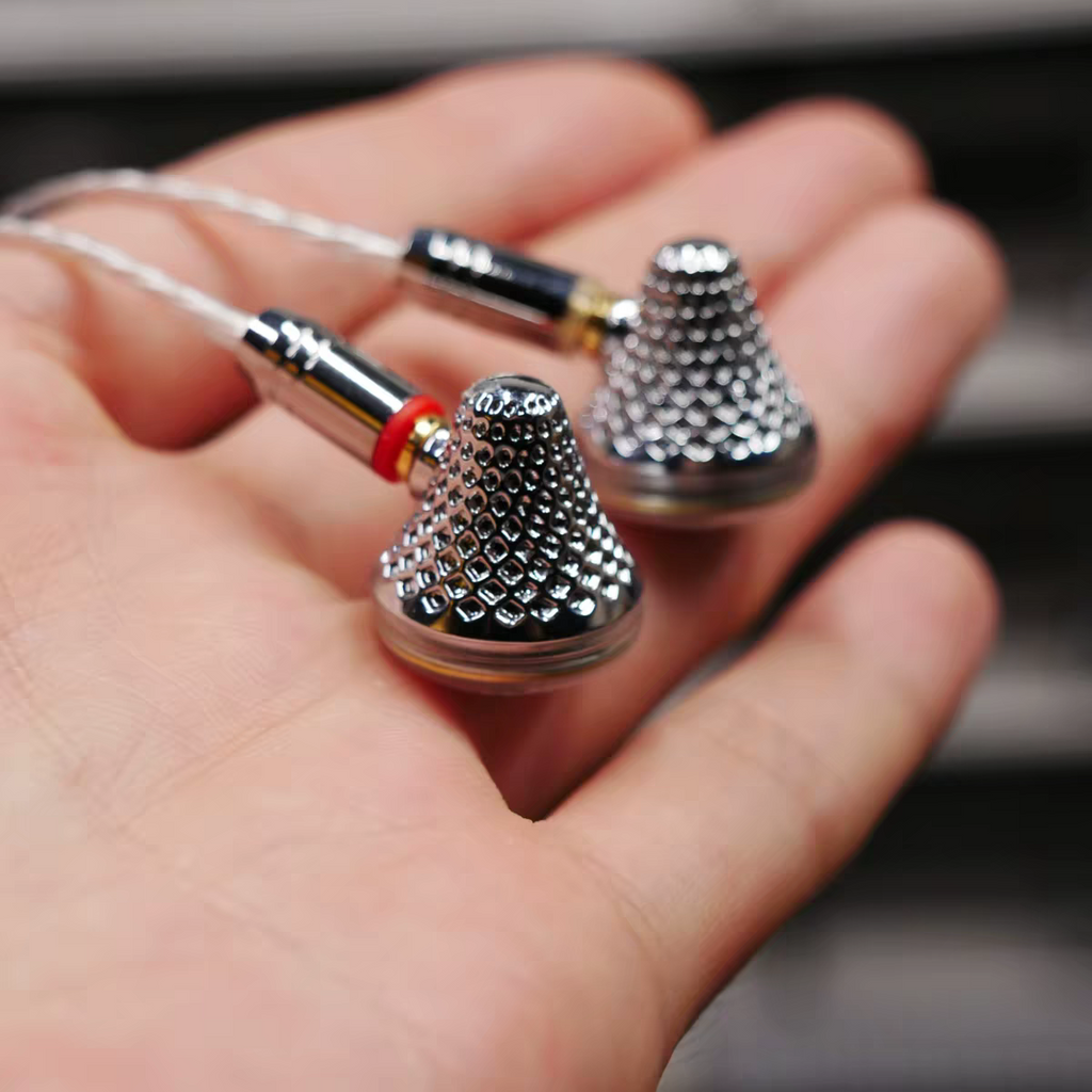 Close-up of metal flathead earbud housing