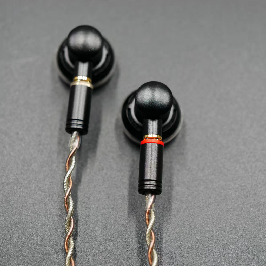 Close up of flat head earbud housings