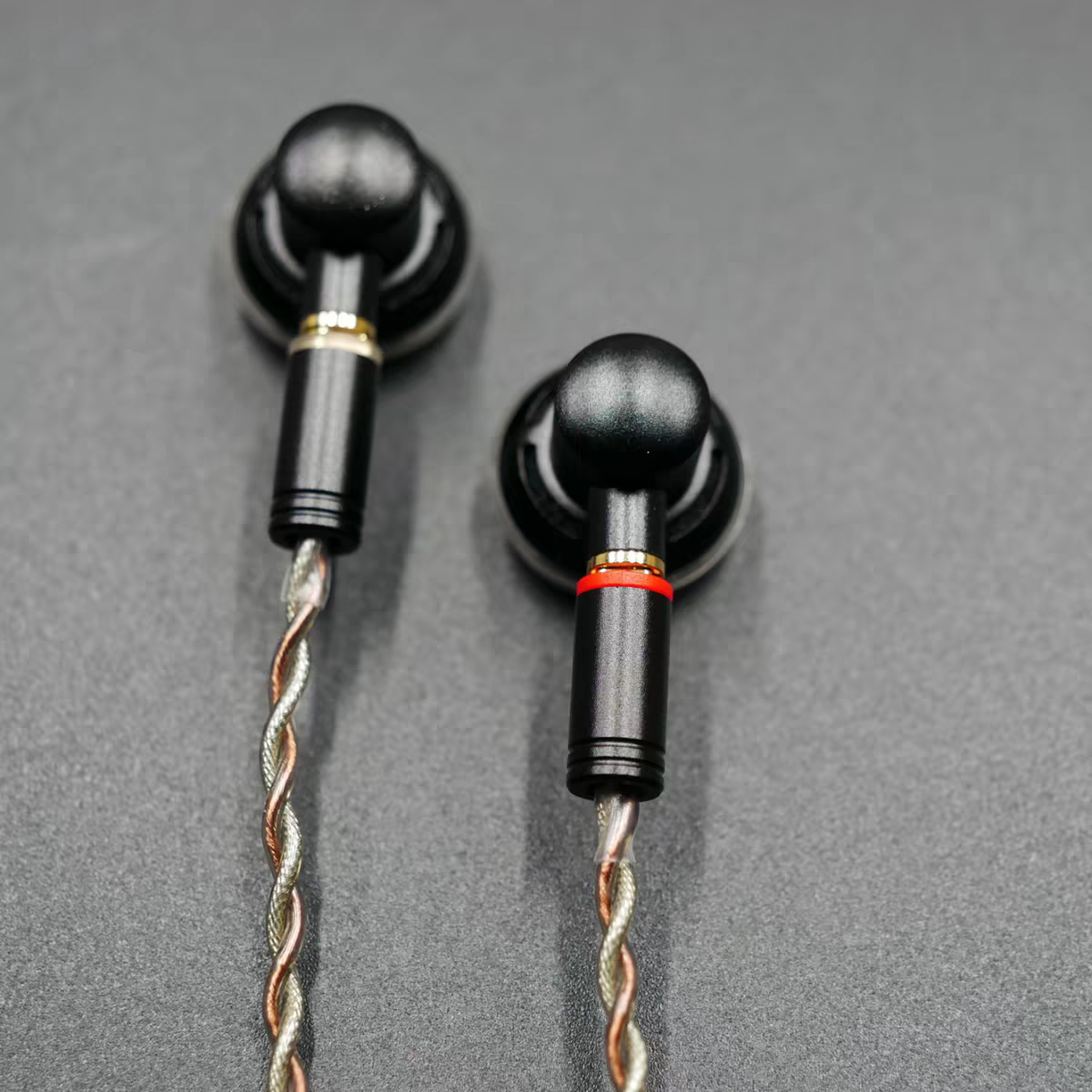 Close up of flat head earbud housings