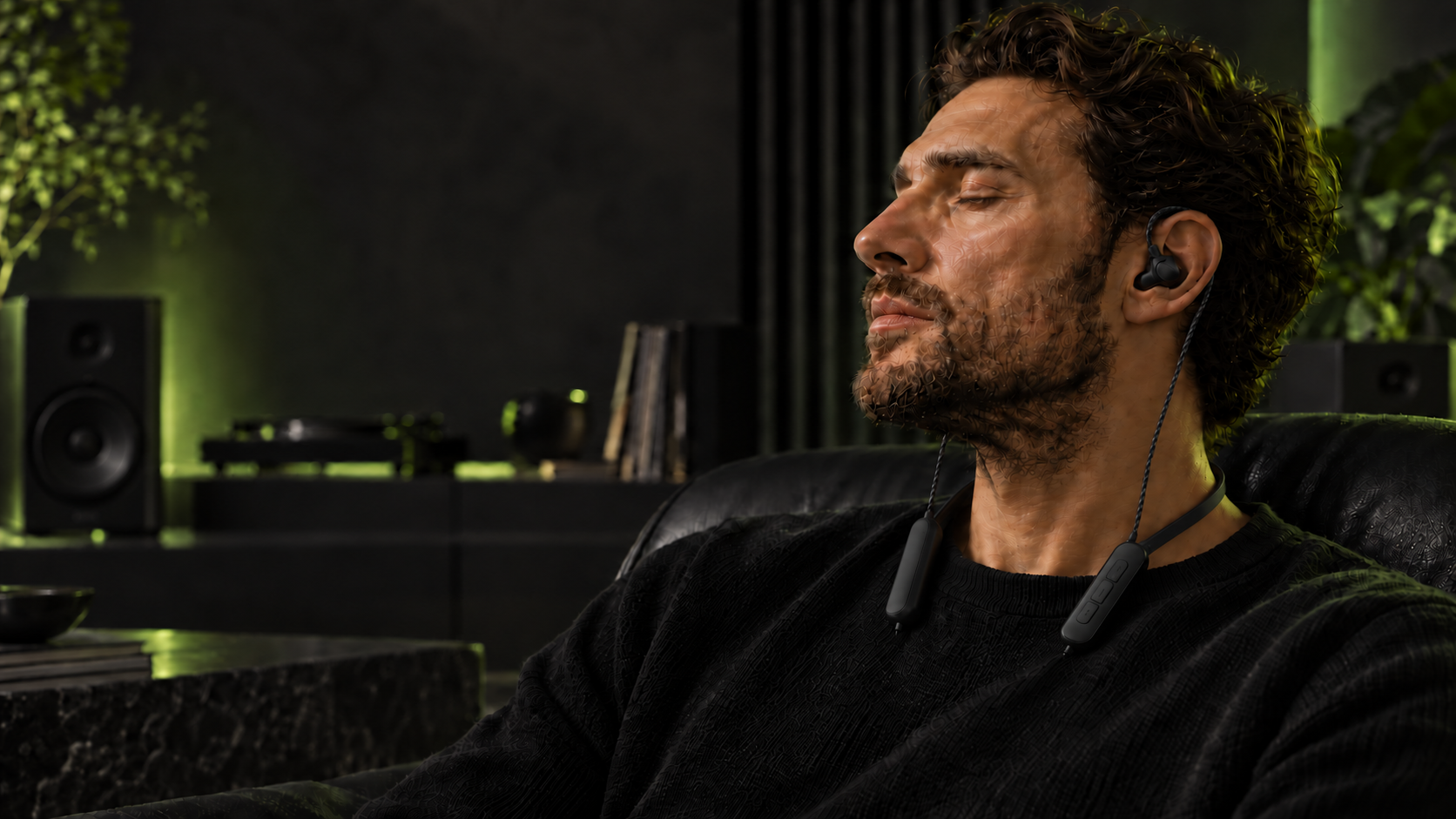 Audiophile wearing a QCC5181 Bluetooth IEM cable in a dark listening room